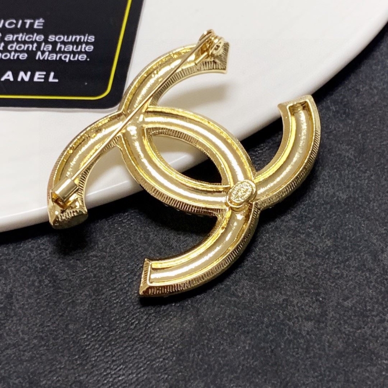 Ch**el brooches